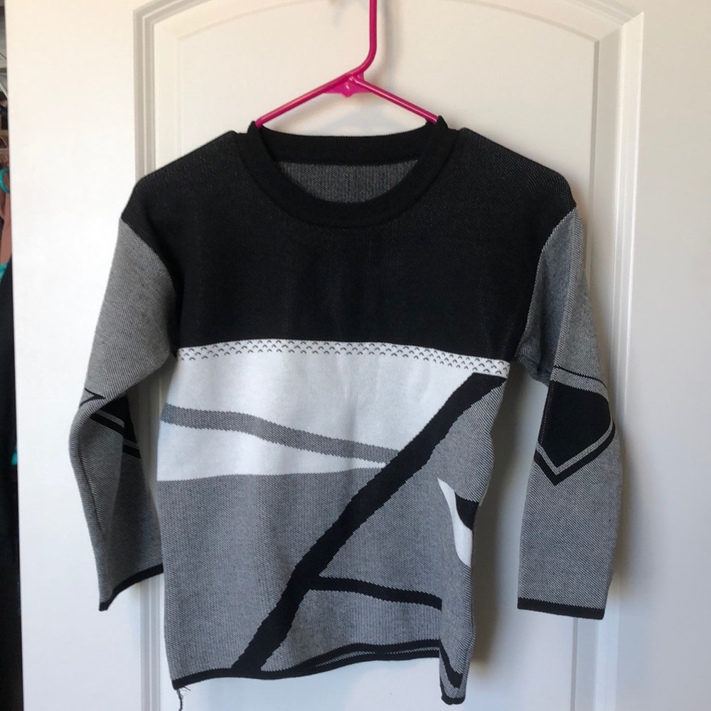 Cute black and white sweater.